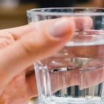 glass of water in hand