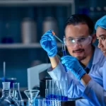2 scientists testing water samples for chemicals