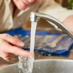 child drinking school tap water