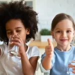 childs drinking water at school or daycare