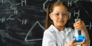 little girl scientist with chemicals