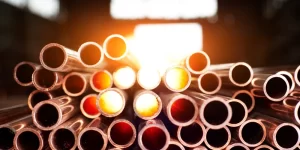 many copper pipes with sun