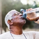 old man drinking water