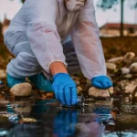 scientist taking water sample
