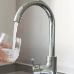 taking a glas of water