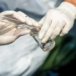 taking water sample from nature