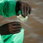 taking water samples from dirty water