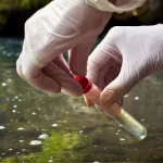 taking water samples from water