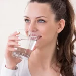 woman drinking glass of water