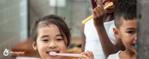 asian childs brushing teeth