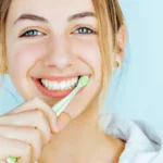 cute woman brushing teeth
