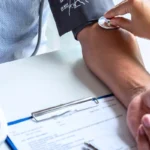 doctor checking male patient