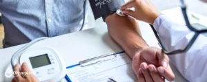 doctor checking male patient