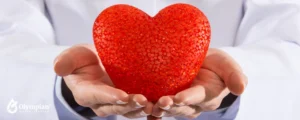 doctor holding a big red hearth