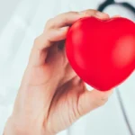 doctor with hearth in hand