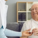 doctor woman speaking with old patient