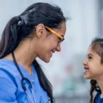 female doctor with little girl
