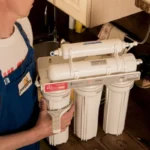 plumber changing water filter 2
