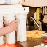 plumber changing water filter 4