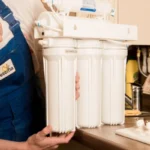 plumber changing water filter 8