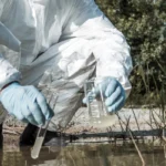 scientist checking pollution river