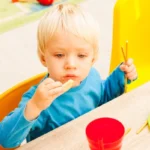 small daycare child eating