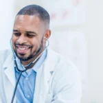 smiling male doctor with patient