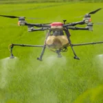 spraying water on field from drone