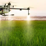 spraying water on field with drone