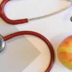 stethoscope and apple