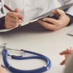 stethoscope and tablet on doctor table