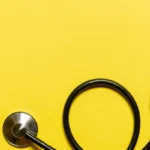 stethoscope on yellow background