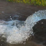 water pouring on field