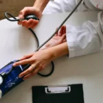 woman doctor checking muslim woman