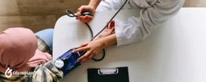 woman doctor checking muslim woman