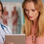 woman doctor showing results to patient