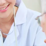 woman doctor with old patient