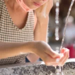 woman drinking public water