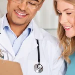 young doctor showing results to patient