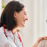 young woman doctor with old woman patient