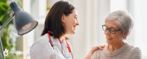 young woman doctor with old woman patient