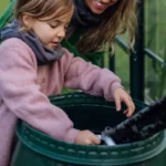 girl playing in rainwater harvesting
