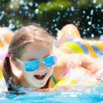 girl swimming in pool water