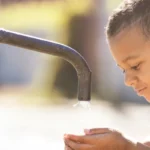 kid drinking tap water