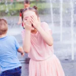 kids playing in public fountain 5