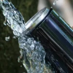 taking spring water with bottle 2