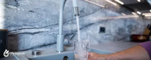 taking water in glass from tap 2