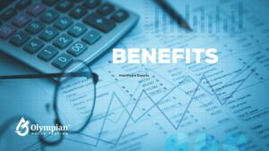 Calculator, glasses, and financial data representing the benefits of alkaline water.