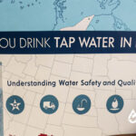 Can you drink tap water in Kansas? Glass of tap water with Kansas map. Understanding water safety and quality in Kansas.
