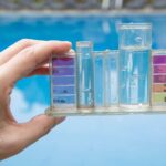 Water testing kit. Hand holding a chlorine test kit to test chlorine levels in drinking water.